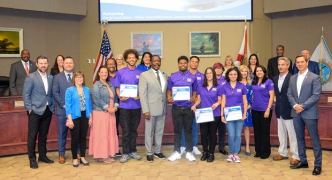 Image of group of people receiving certificate