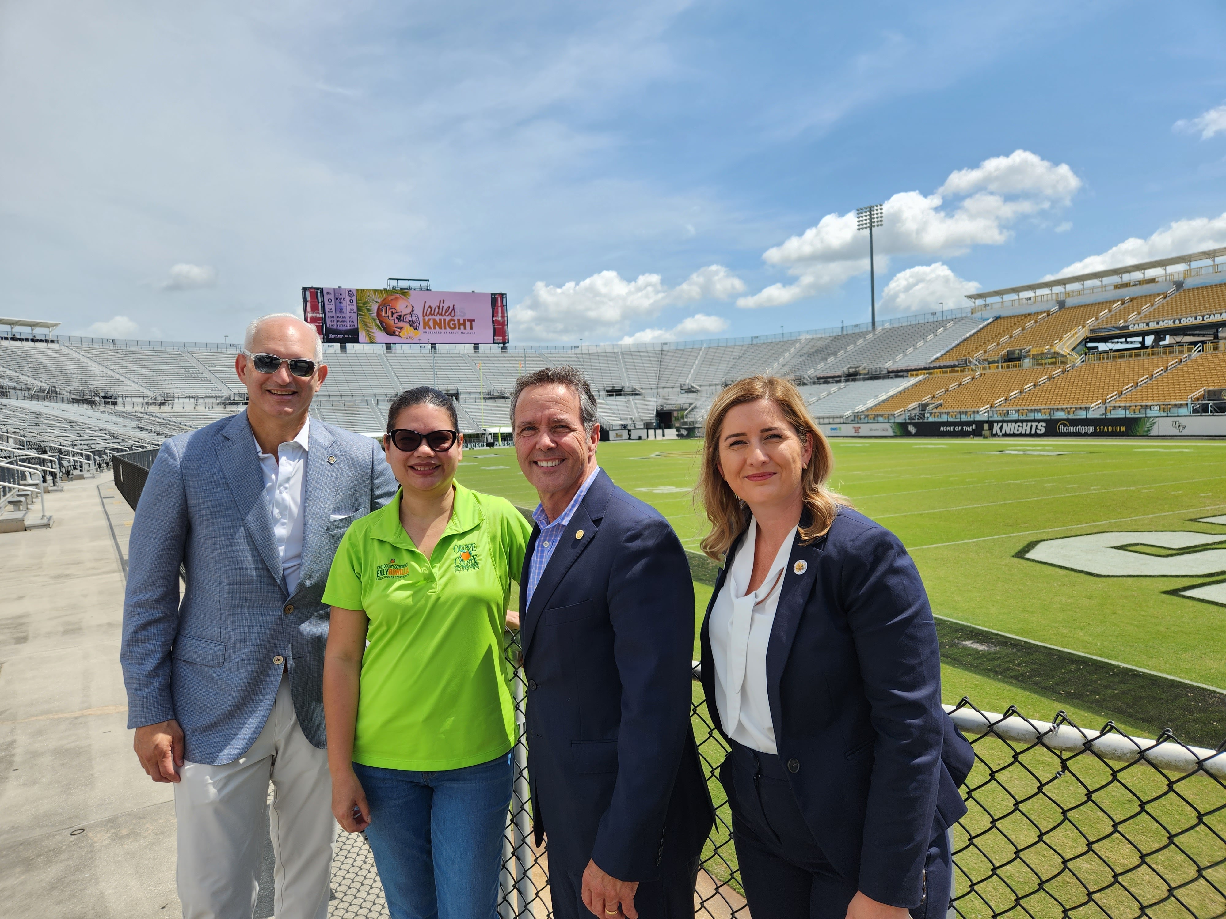 Commissioner Bonilla and members of UCF posing for a picture during the tour of UCF Athletic Department