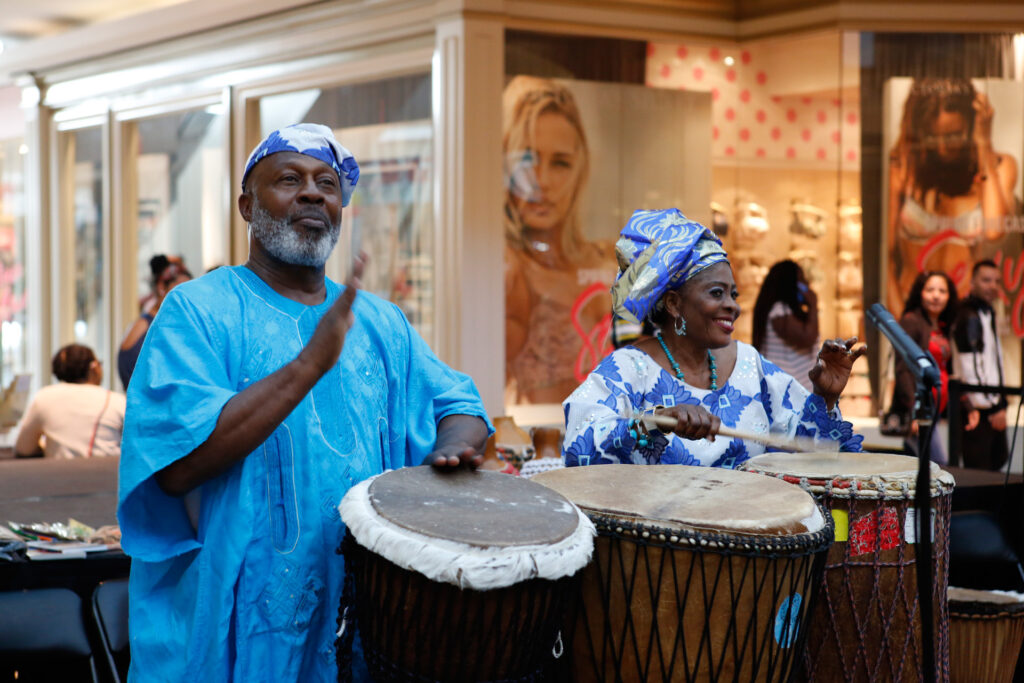 Don and Tutu Harrell hitting the drums during one of their Orisirisi African folklore performances.