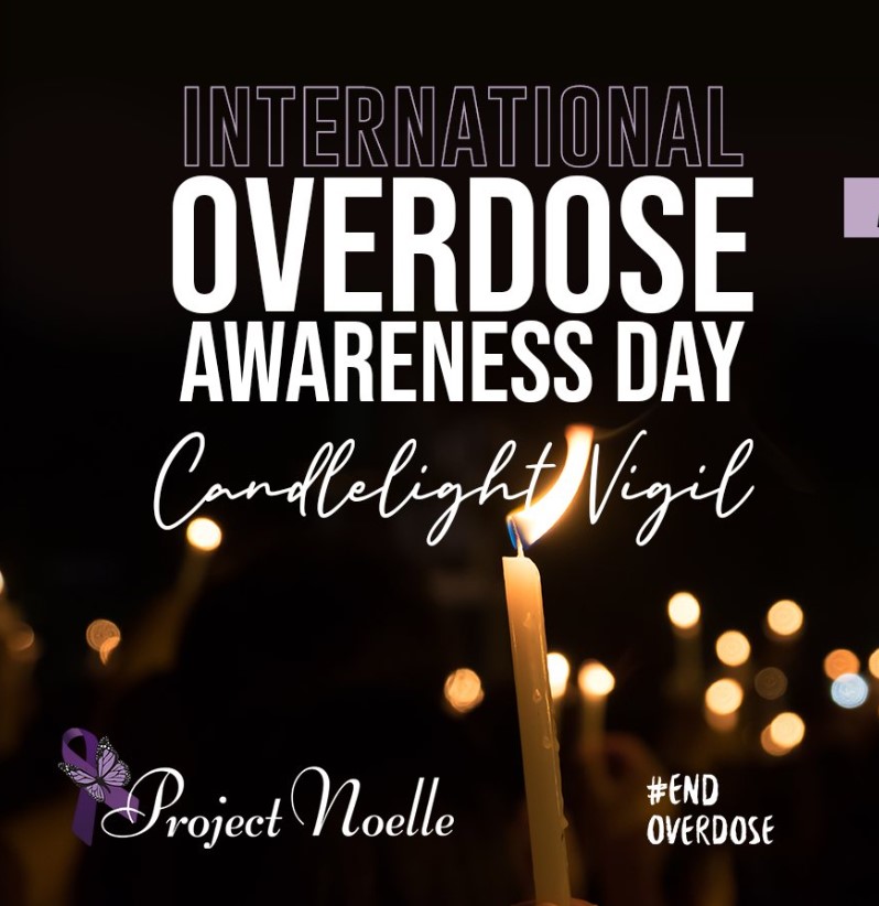 "International Overdose Awareness Day Candlelight Vigil" graphic with #EndOverdose and lit candles behind the text.