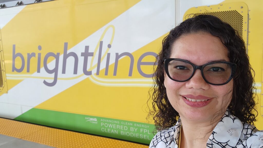 Selfie of Commissioner Emily Bonilla in front of the Brightline train