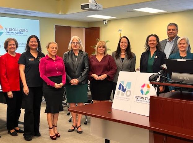 Commissioner Emily Bonilla with MetroPlan Orlando Board members at press conference.