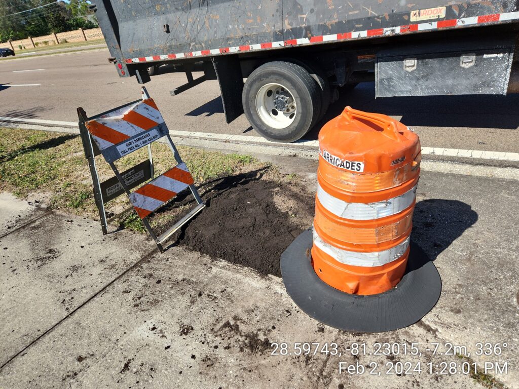 Photo of the successful case resolved after the Roads & Drainage Division closed the hole near the storm water drain. 