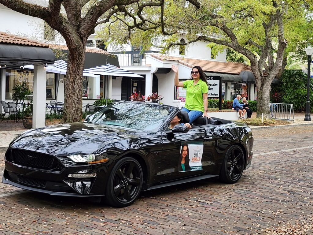 Commissioner Emily Bonilla in convertible at the Winter Park St. Patrick's Day Parade.