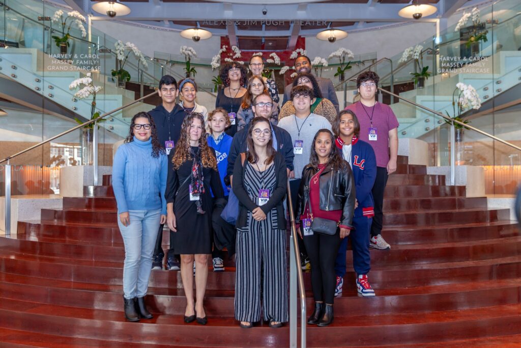 This is a photograph of Commissioner Emily Bonilla with the kids from District 5 at the Dr. Phillips Center to see Broadway's Aladdin