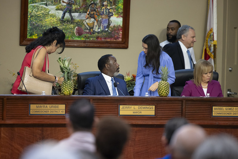 Commissioner Emily Bonilla and Mayor Jerry Demings have a conversation at the dais