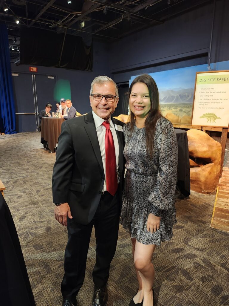 This is a photograph of Commissioner Emily Bonilla standing with the Victim Service Center's Executive Director Lui Damiani