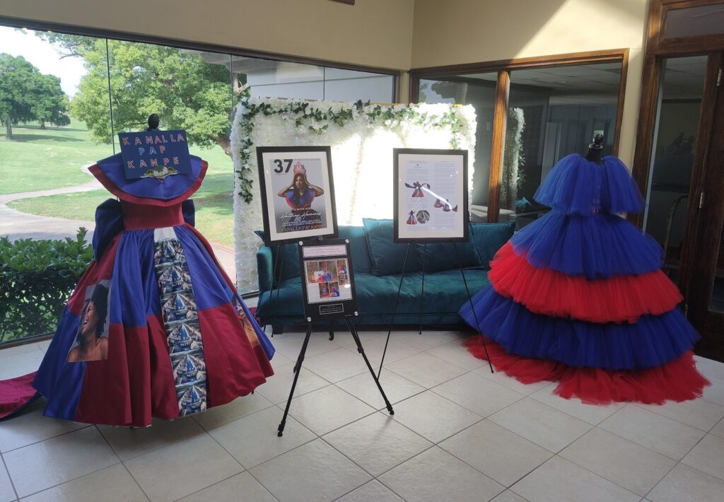 This is a photograph of the blue and red dresses worn in celebration of Haitian Flag Day