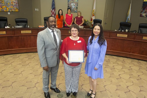 photograph of Commissioner Bonilla, Mayor Demings, and Rev. Dr. Tracie Barrett